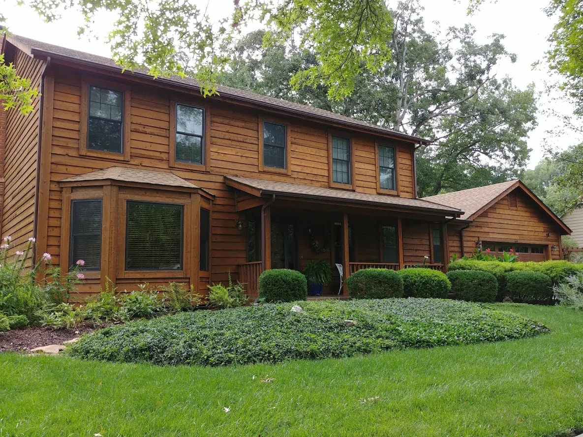 Maintained cedar lap siding on an established home