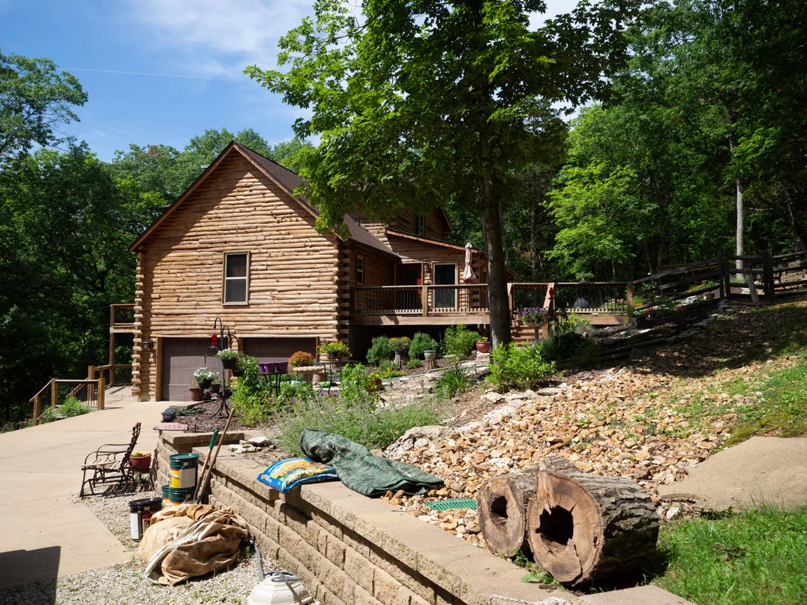 Log home showing uneven weathering from sun exposure