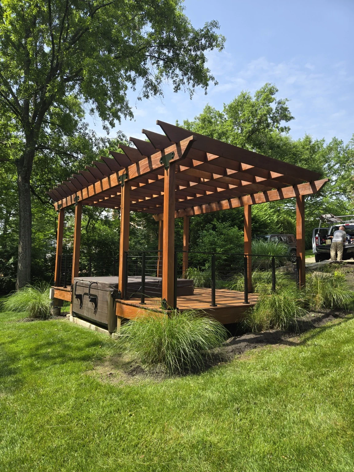 Ipe deck and trellis in landscaped backyard
