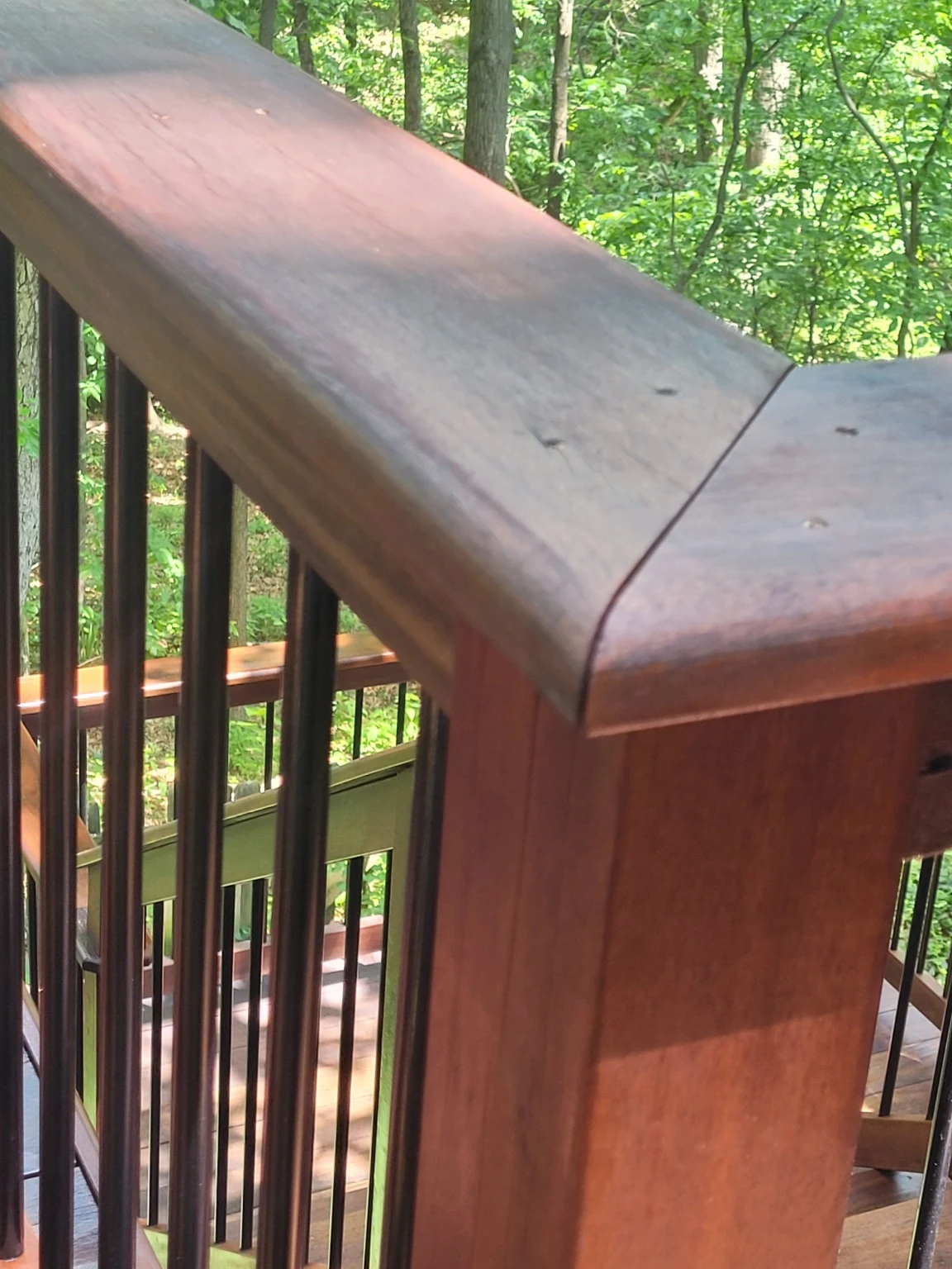 Restored Tigerwood handrail showing fitted corner detail